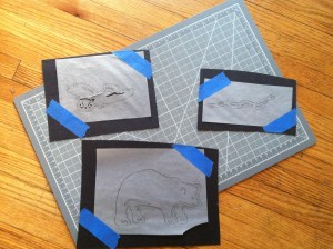 Puppets in process of being cut out. After they are cut, we add velcro, sometimes to both sides so we can flip them. 