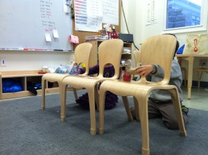 The chairs allowed students to play puppets both above and below the seats. 
